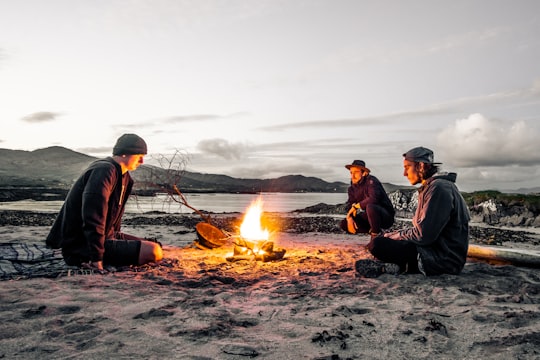 three men in front of bonfire in Wexford Ireland