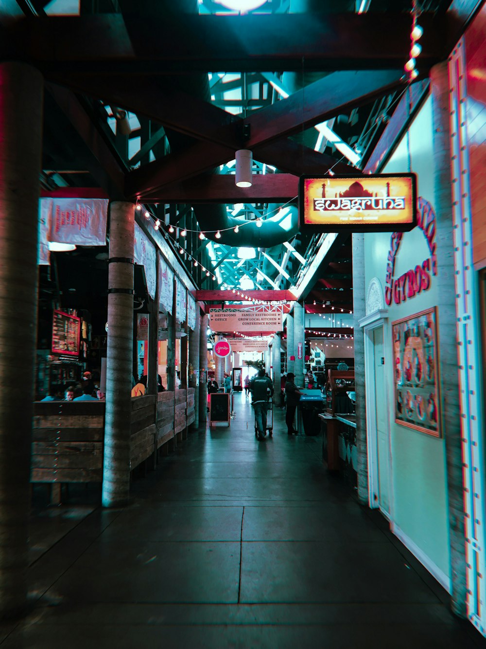 people walking on pathway inside the building