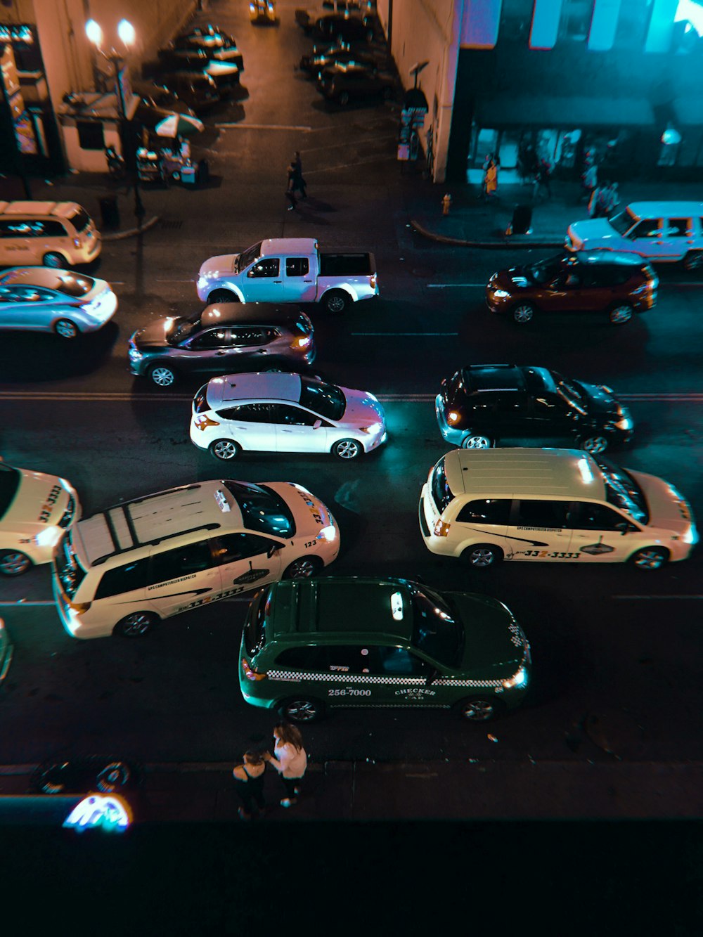 white car park beside store during night time