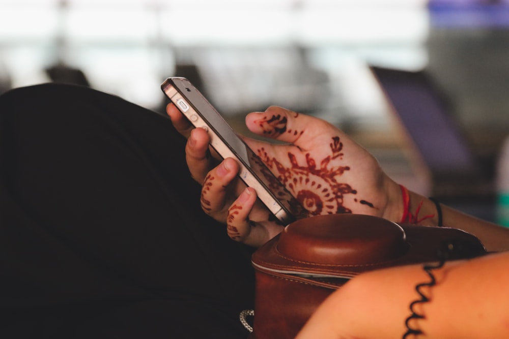 person holding black iPhone