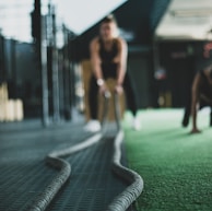 two person inside gym exercising