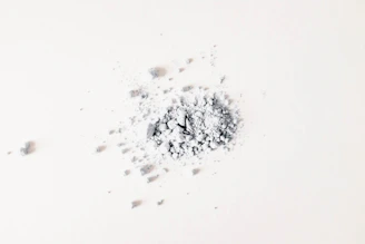 a pile of white powder sitting on top of a white table