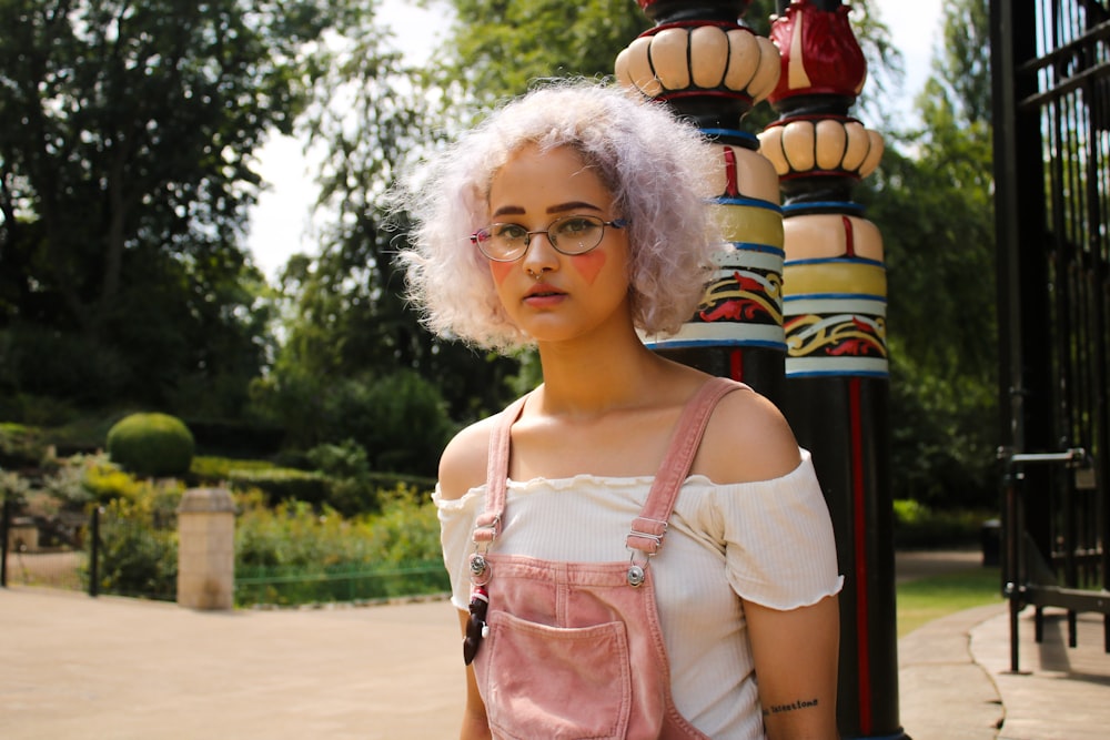 woman standing near post outdoor