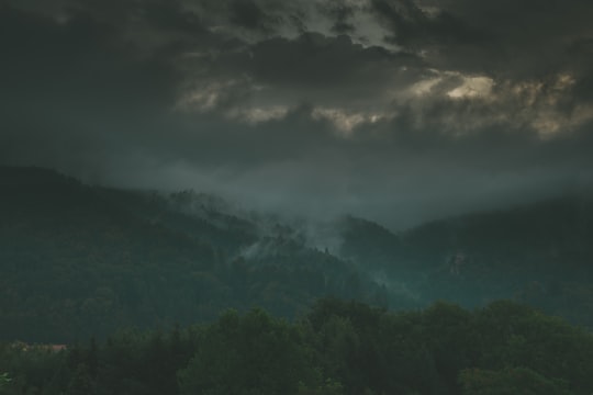 green mountains under gray clouds in Peggau Austria