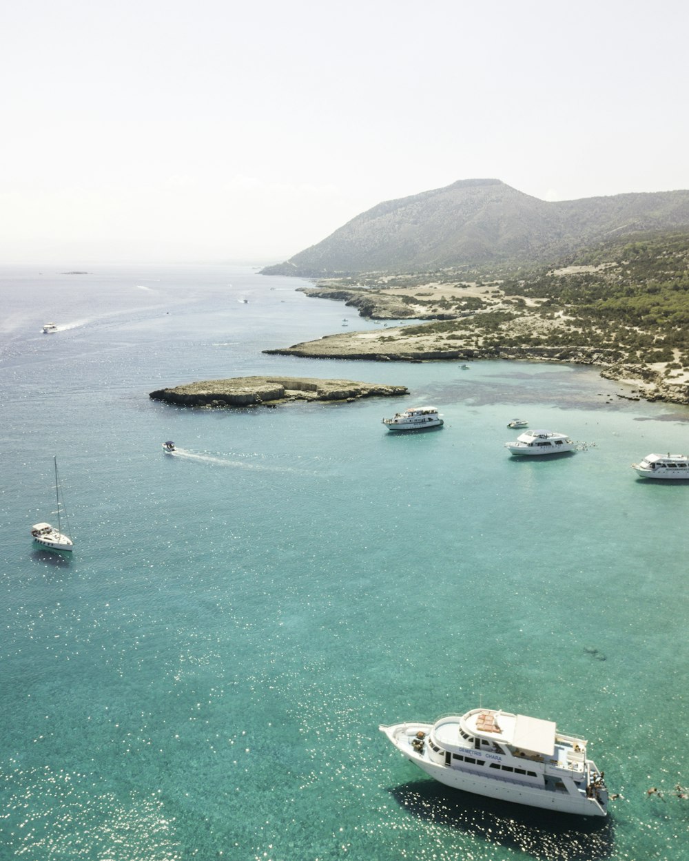 yachts on body of water at daytime