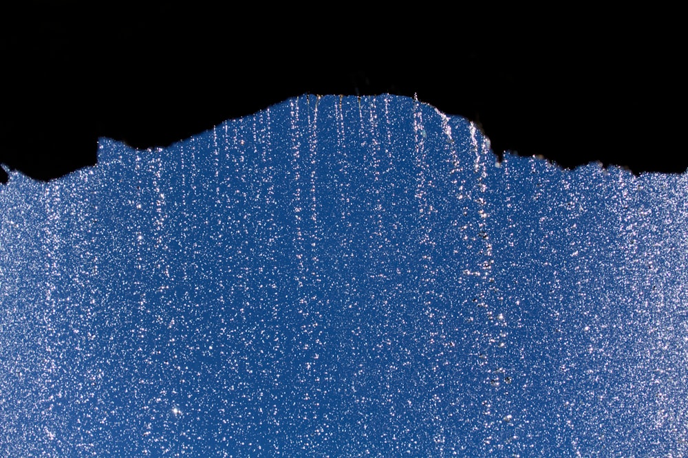 silhouette of rock formation with rain droplets