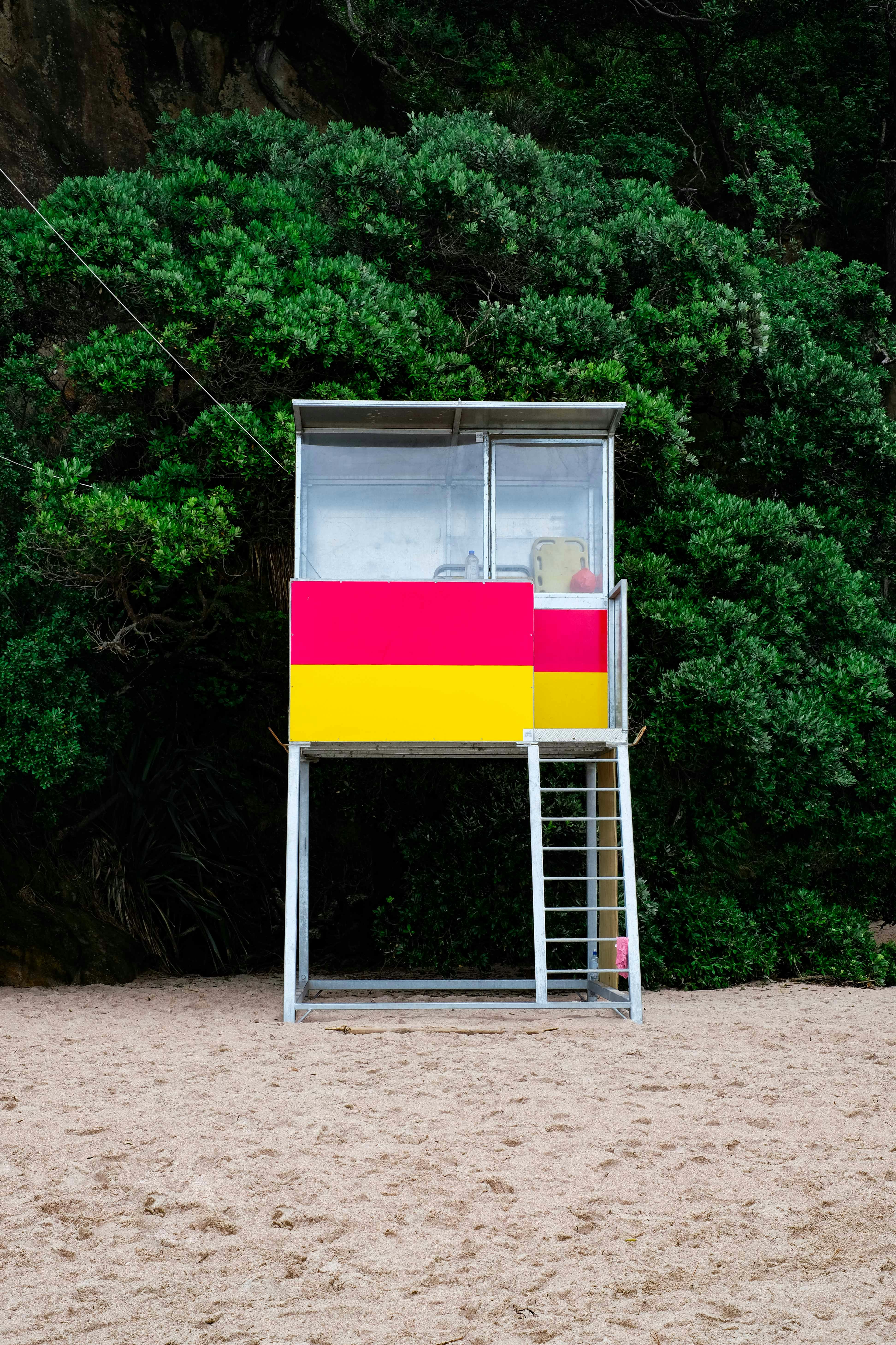 stainless steel lifeguard house beside green tree