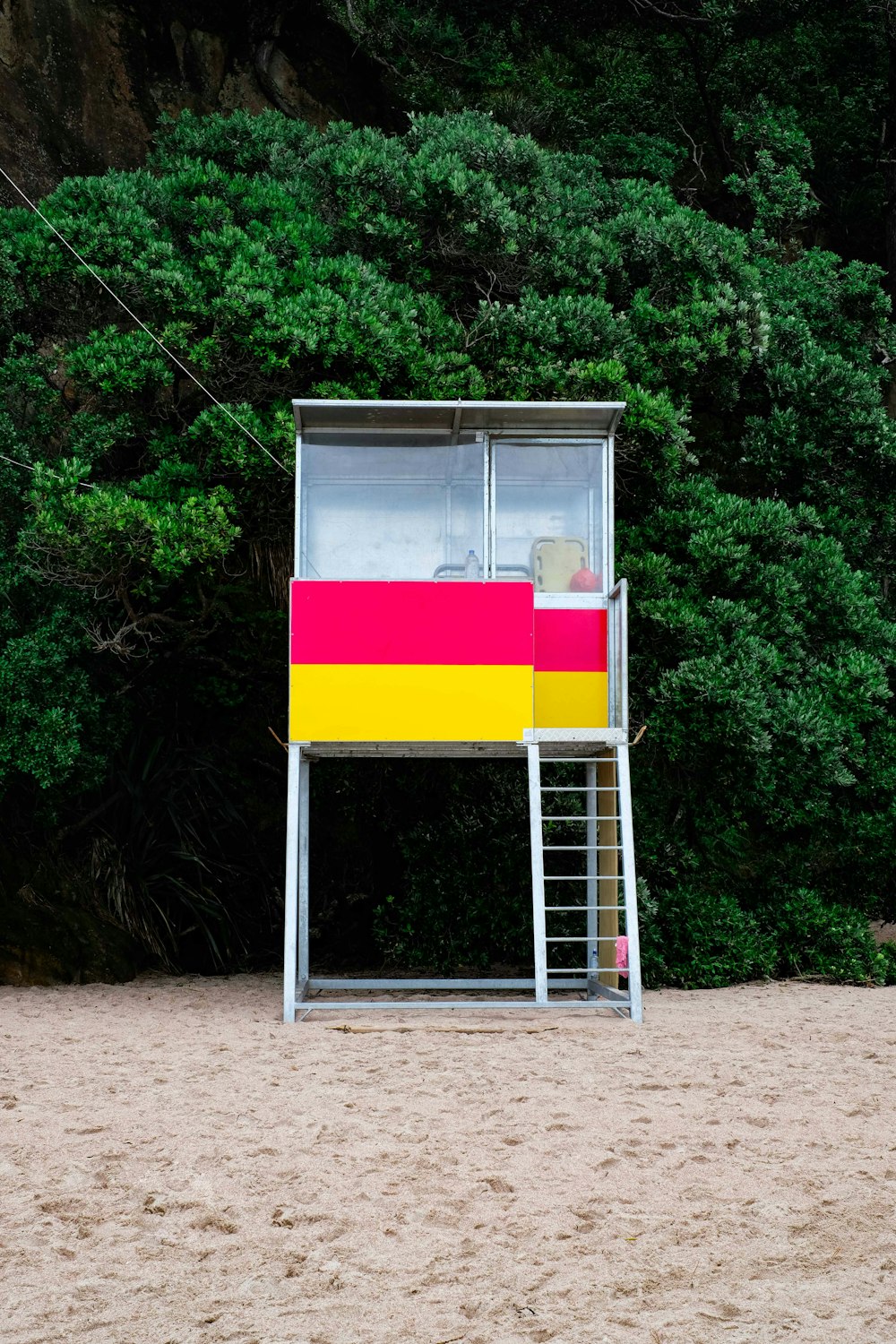 stainless steel lifeguard house beside green tree