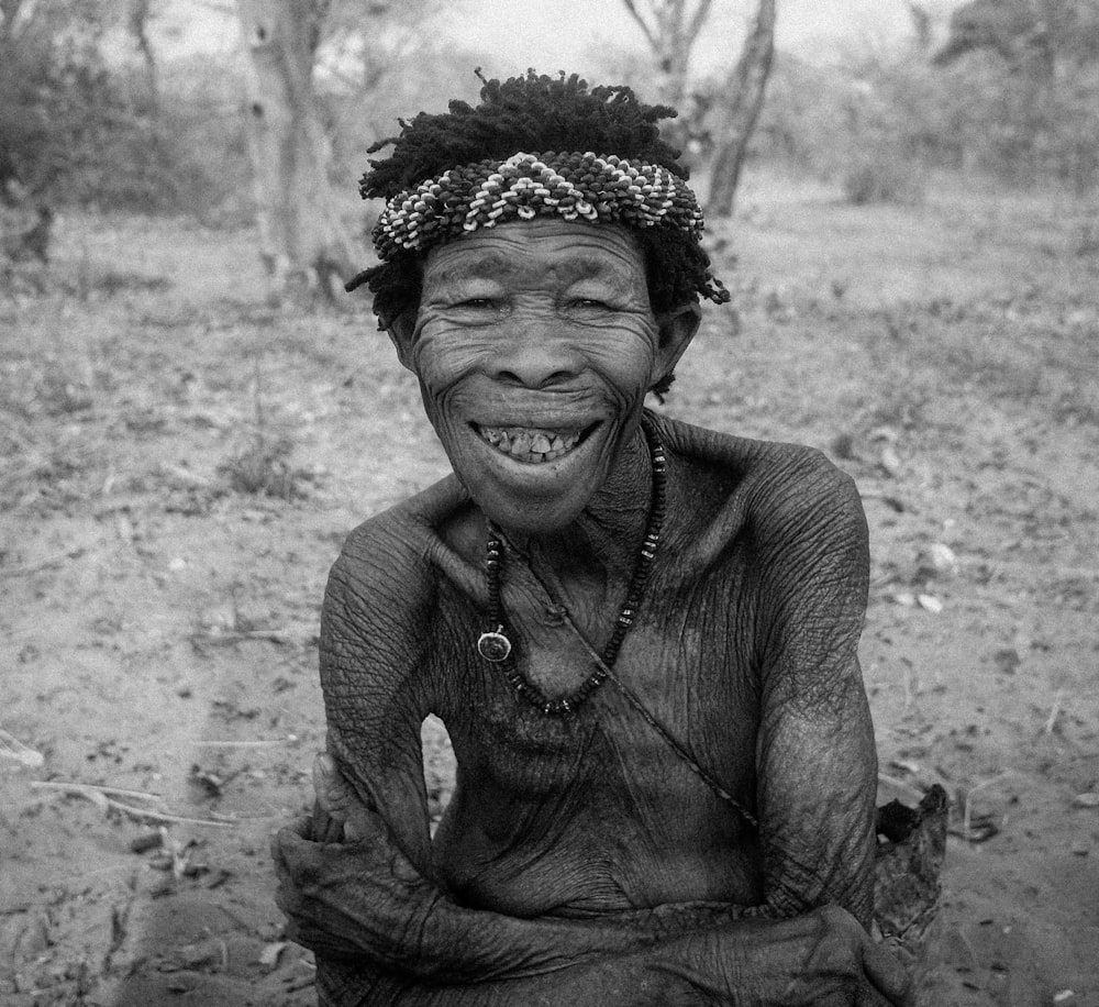 smiling man on grayscale photography