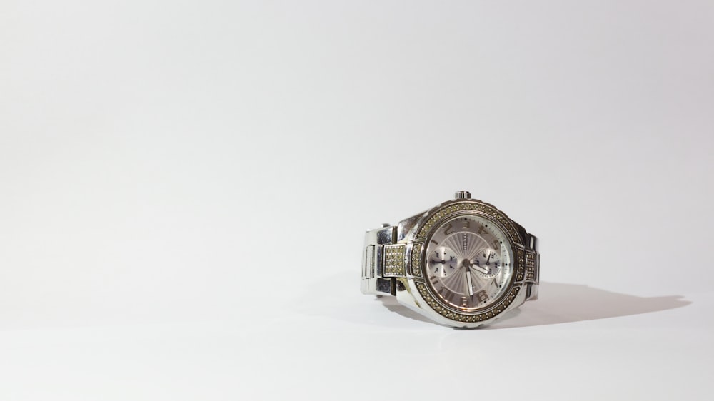 silver-colored watch with link bracelet