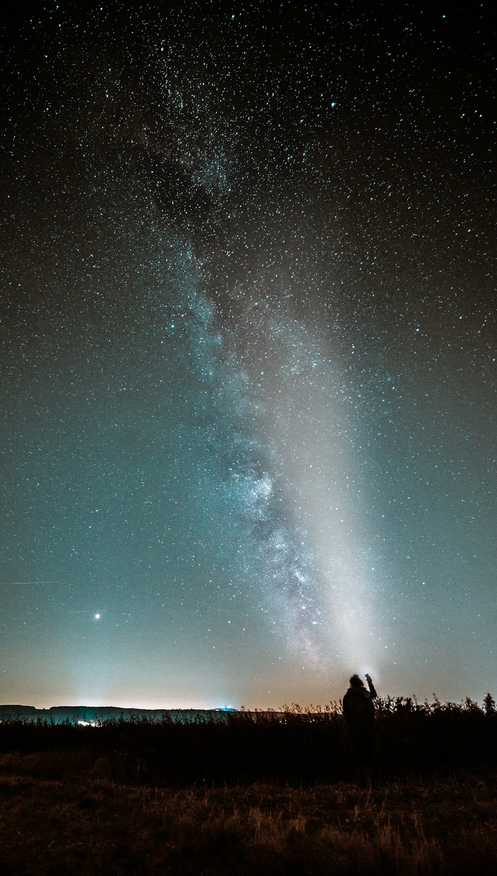 silhouette photography of person watching milky way in sky