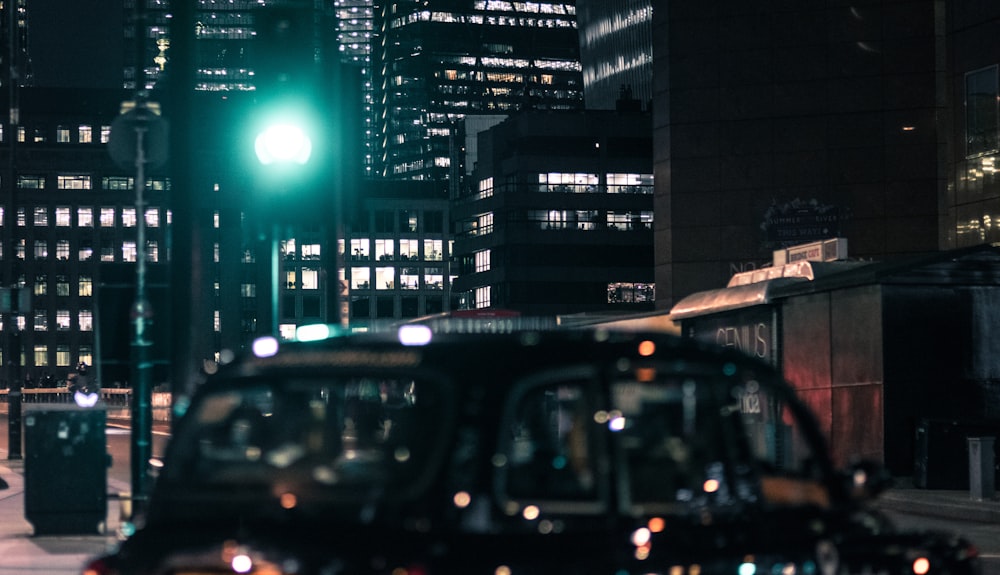 vehicles parked near building at night