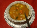 A beautifully arranged plate of low-fat, easy-to-digest vegetable soup.