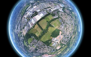 fish-eye aerial shot of buildings and trees