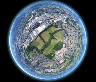 fish-eye aerial shot of buildings and trees