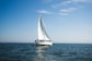 blue and white sailboat on ocean during daytime