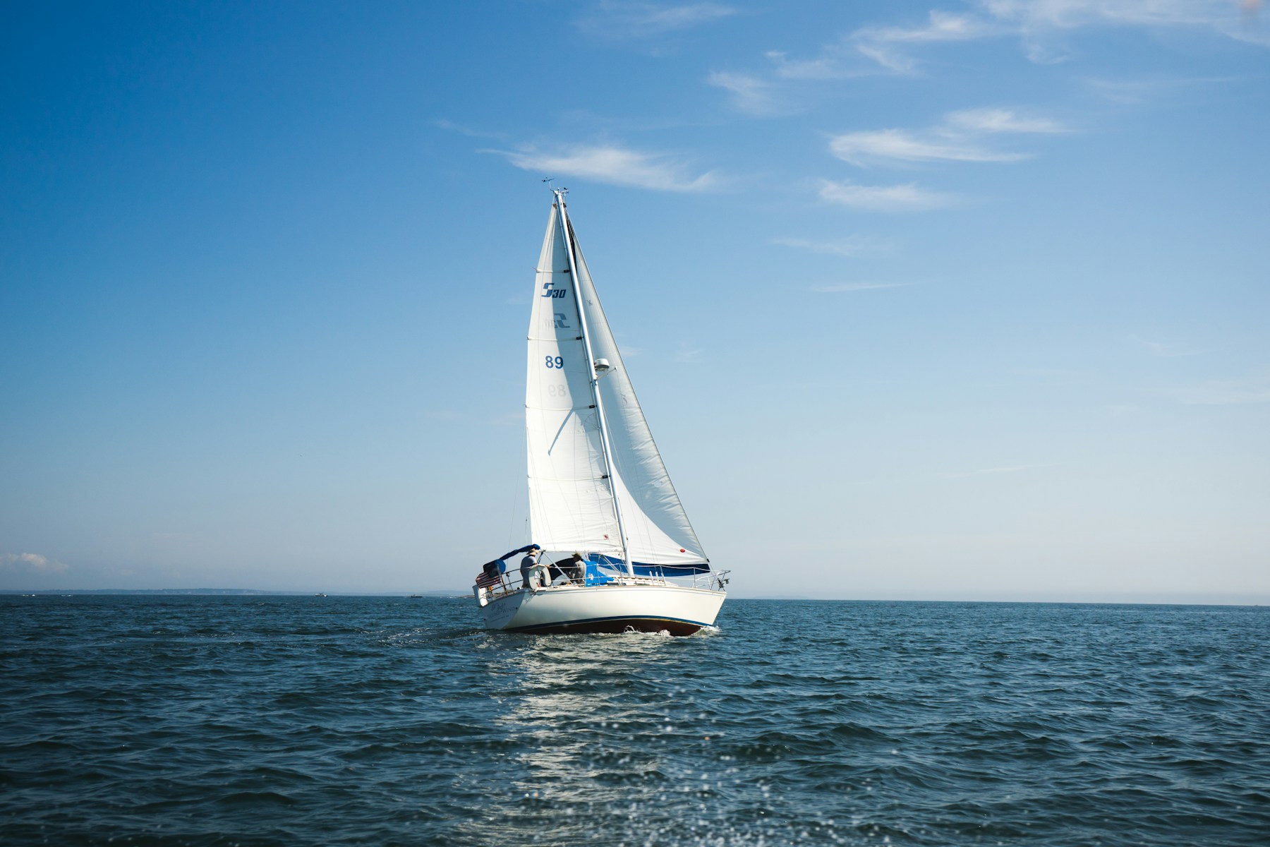 Dark sailing boat dramatic sky