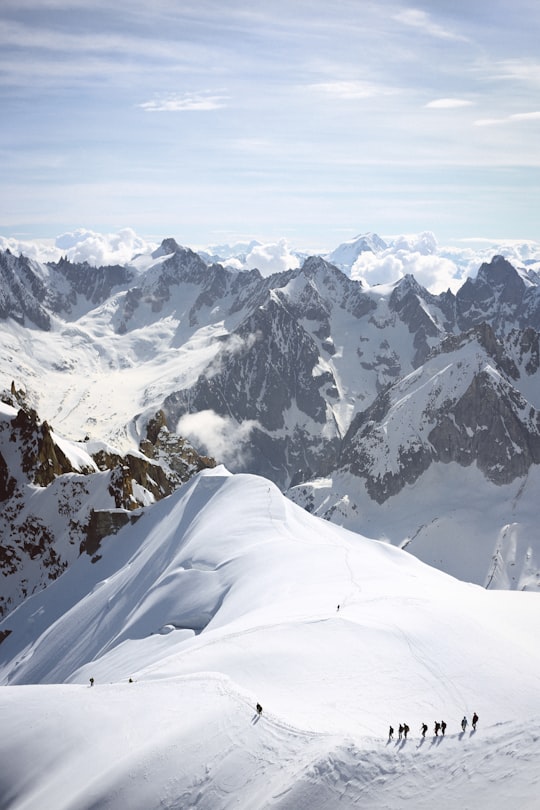 people on snow-coned mountain at daytime in Aiguille du Midi France
