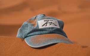 blue cap on brown sand