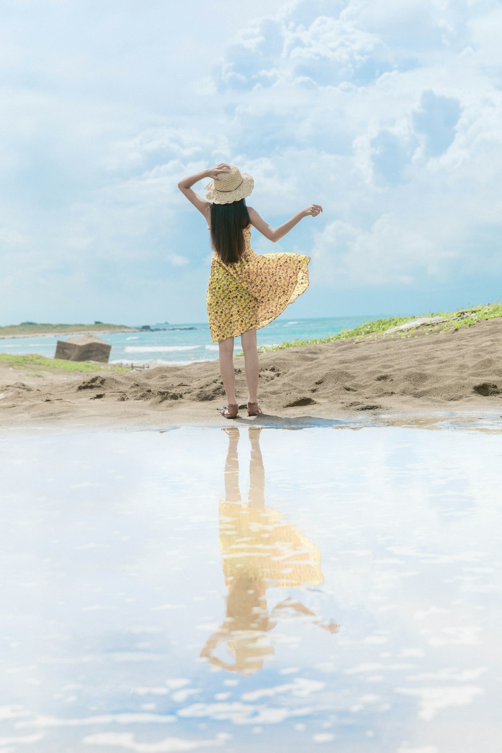 woman standing near body of water