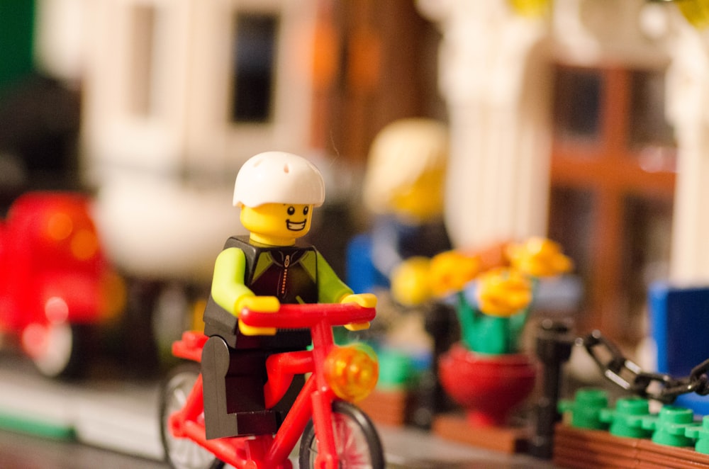 LEGO character riding bicycle