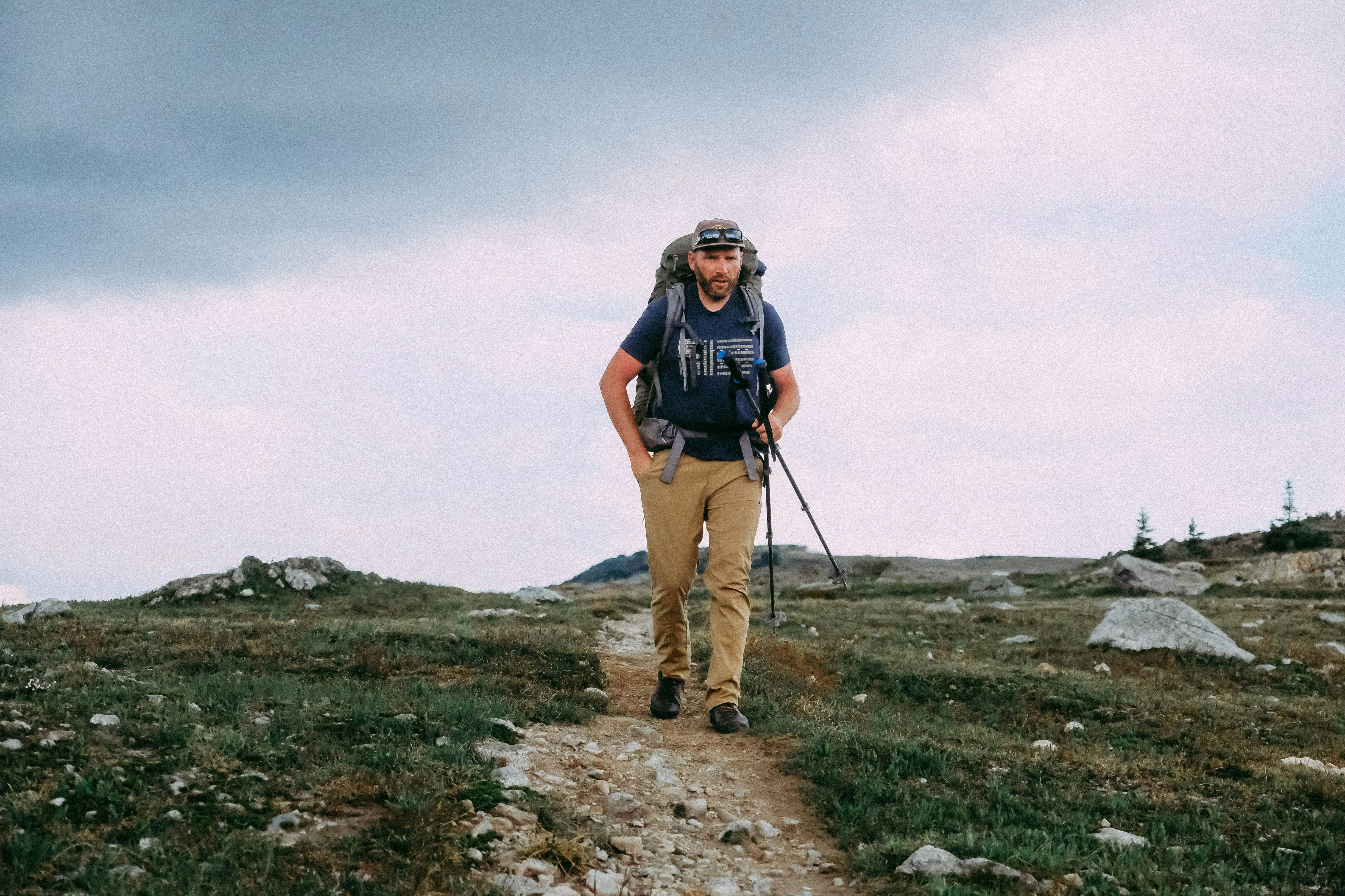 man walking outdoor while carrying backpack