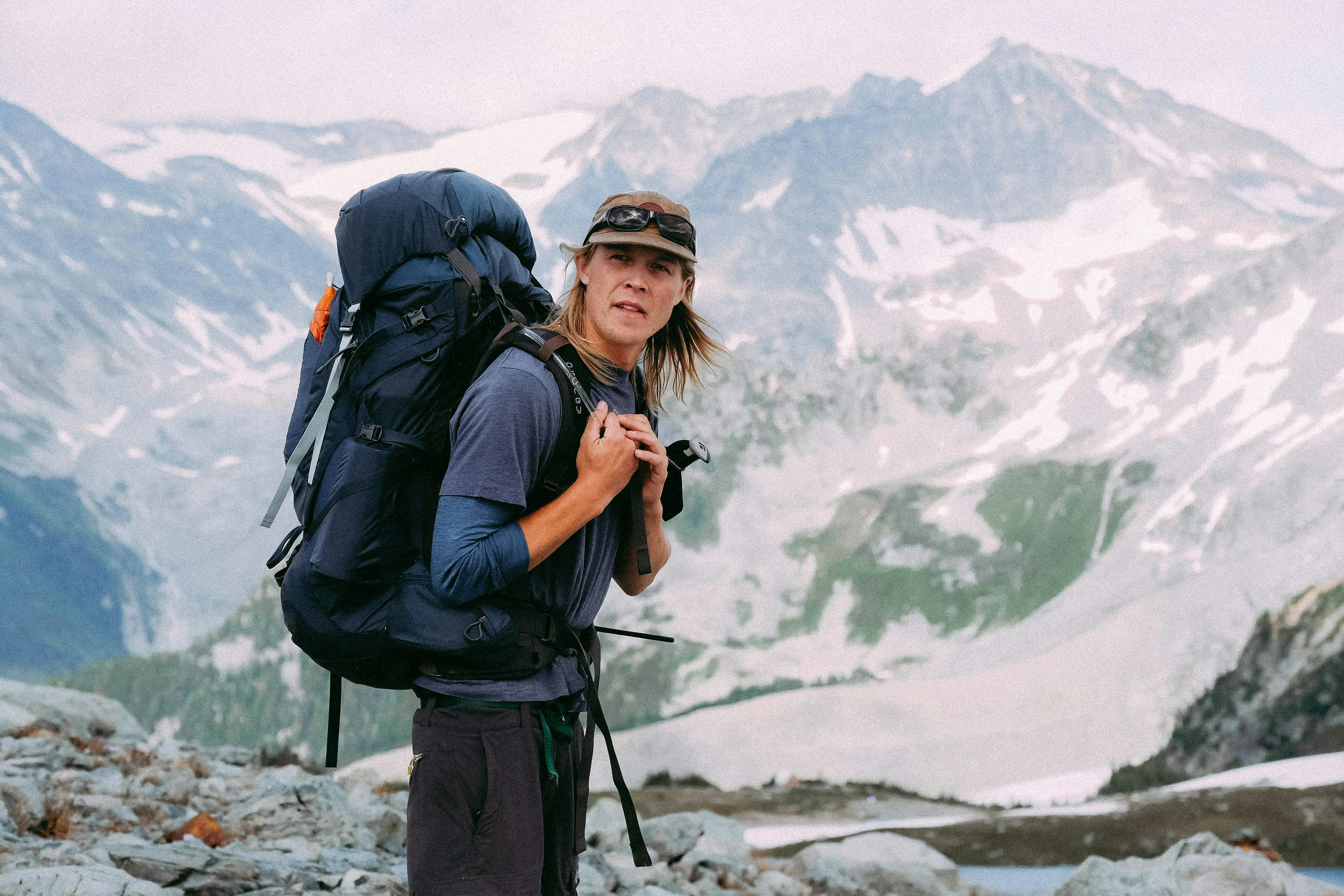 man standing on mountain peak