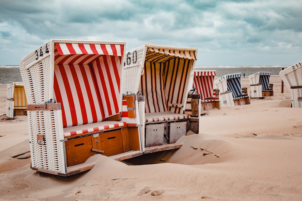 assorted-color chairs on shore during daytime