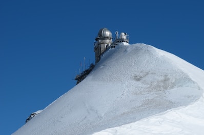 gray structure on top of mountain