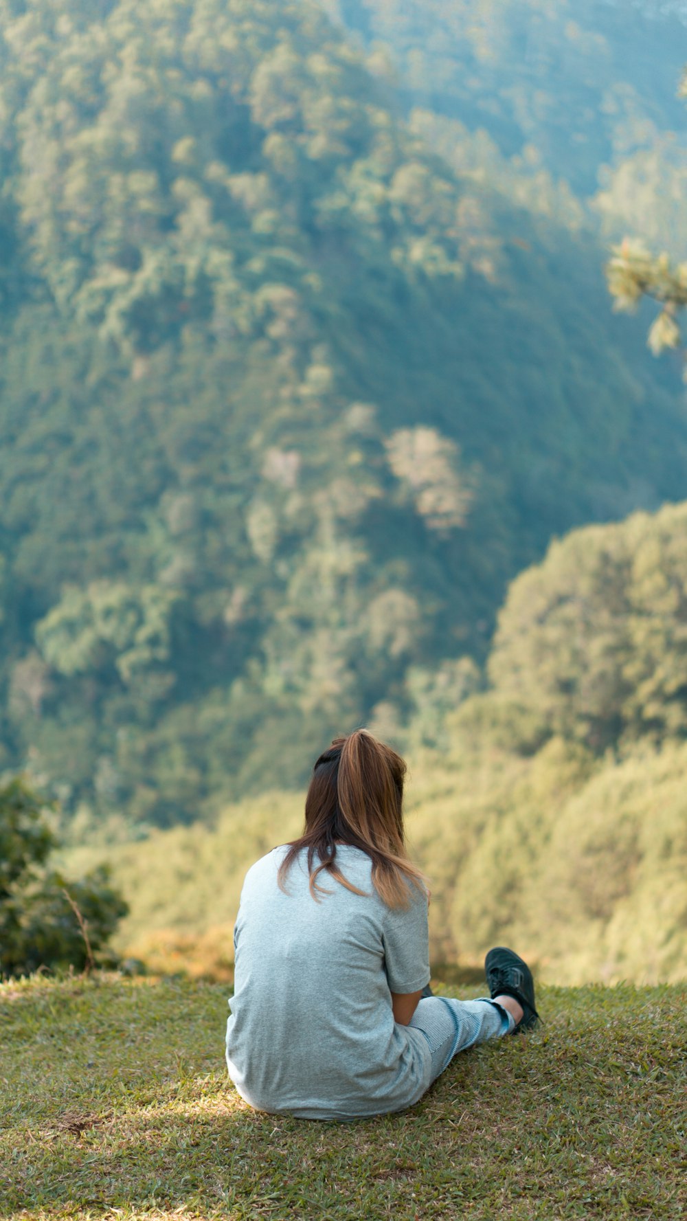 woman sitting on grass