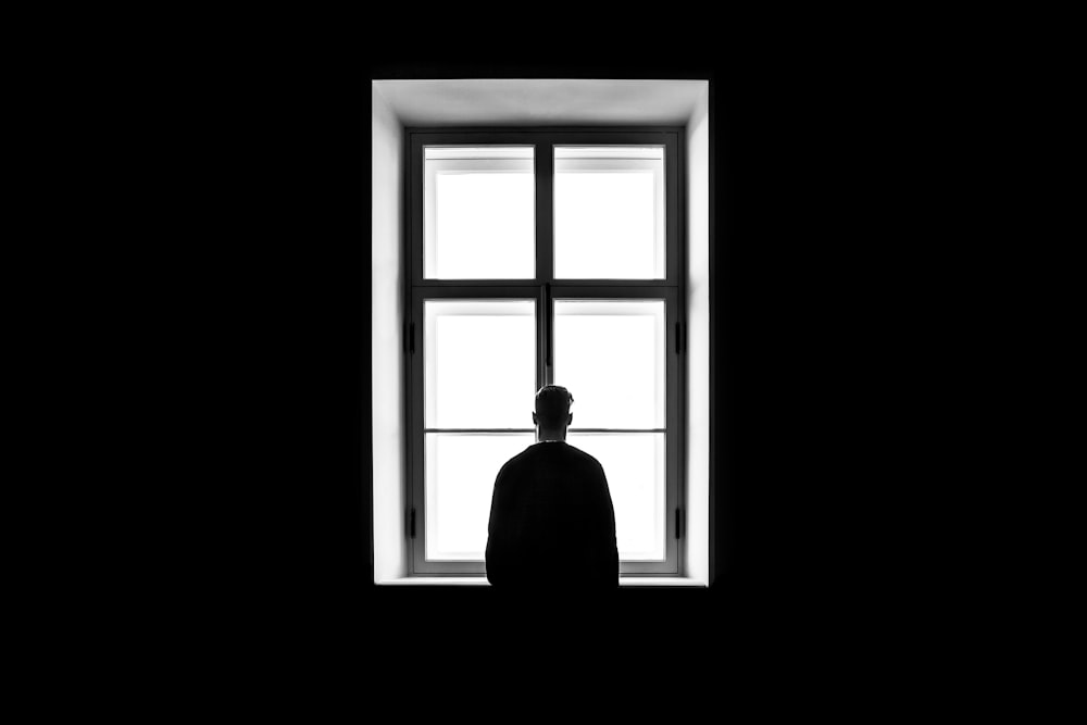 HD wallpaper: silhouette photography of person in front of window