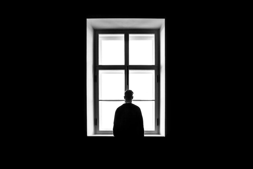  man standing in front of the window window