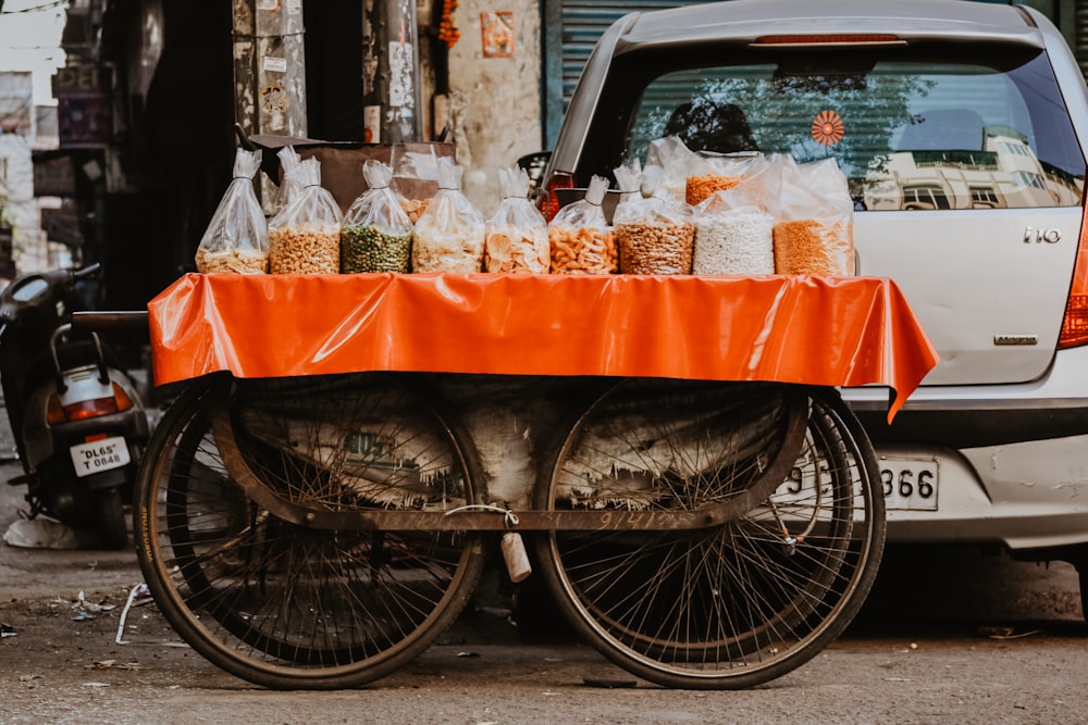 brown cart near silver car