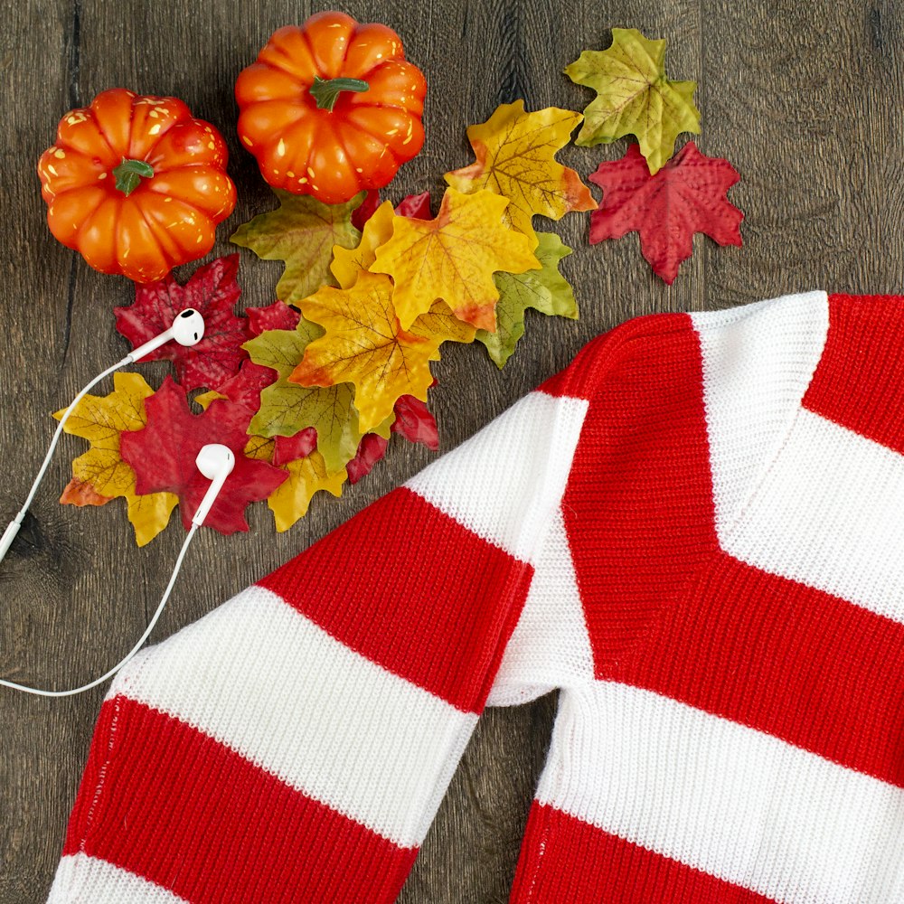 flat lay photography of maple leaf and top