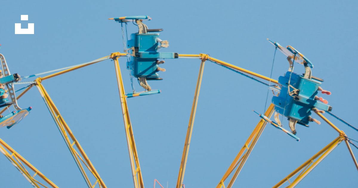Blue and yellow amusement park ride photo – Free Blue Image on Unsplash