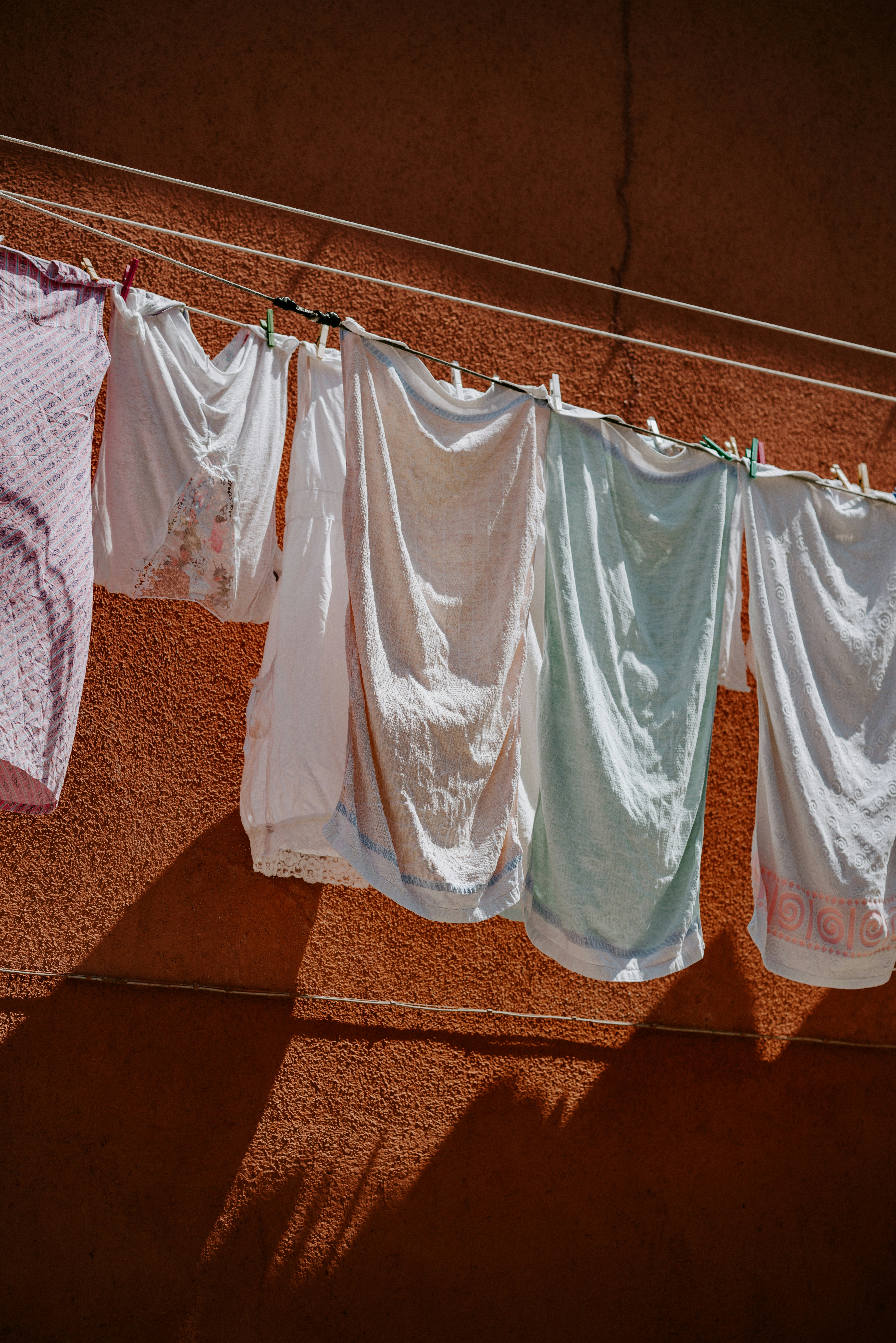 assorted-color clothes hanged on clothesline