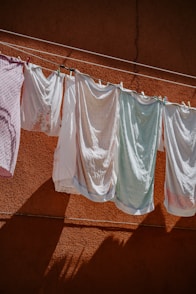 assorted-color clothes hanged on clothesline