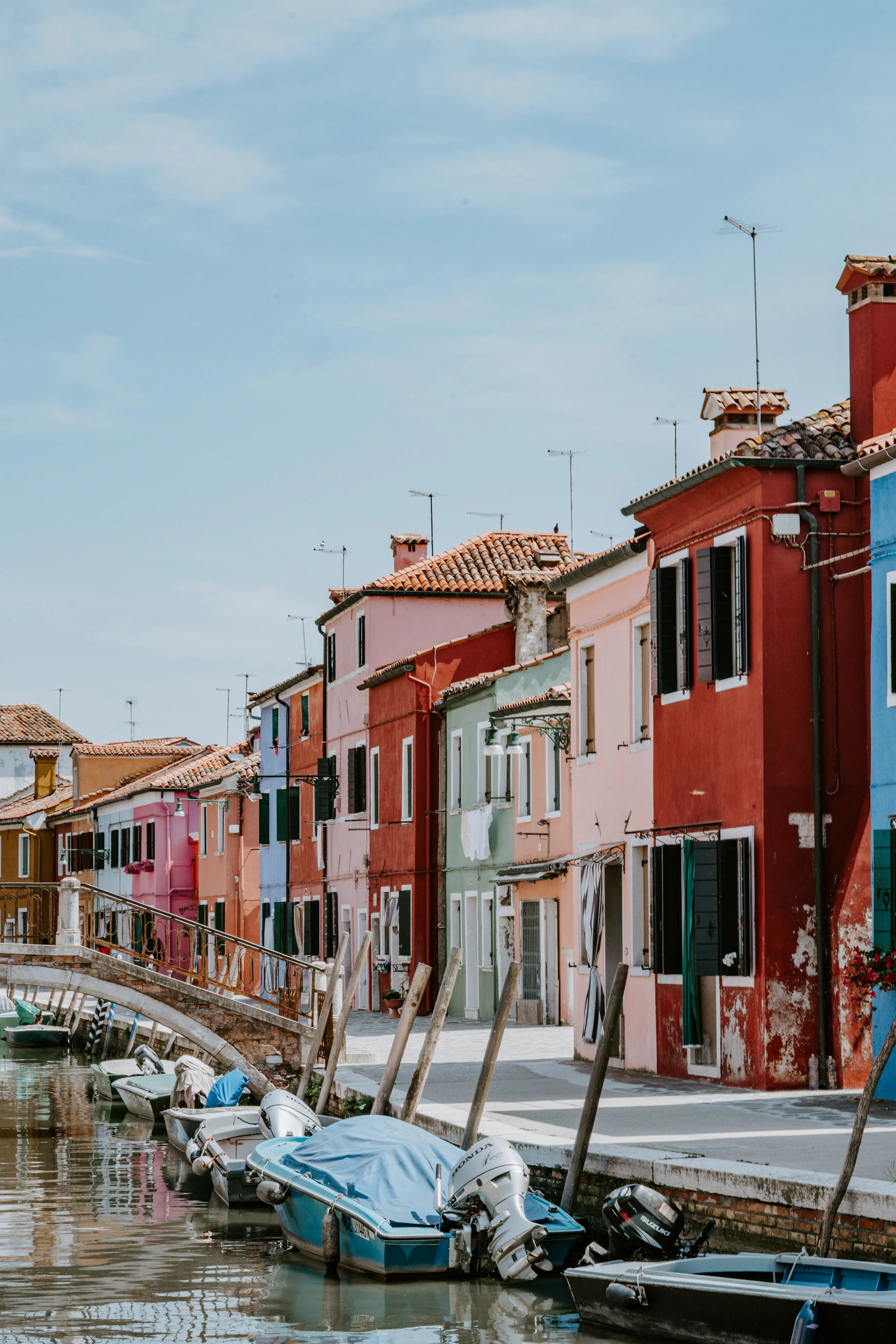 Colourful houses lining a canal on the Venetian island of Burano