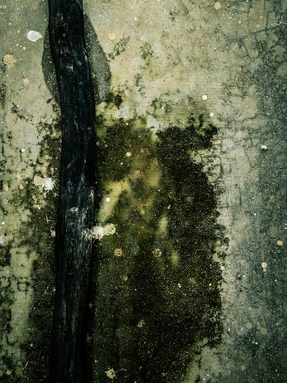 a black object sitting on top of a dirty floor