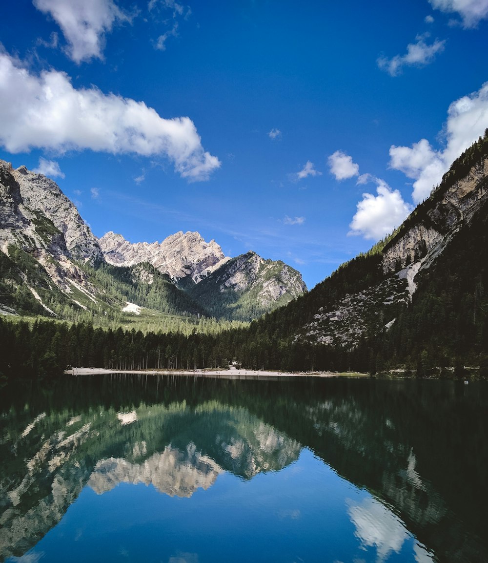 body of water near mountains