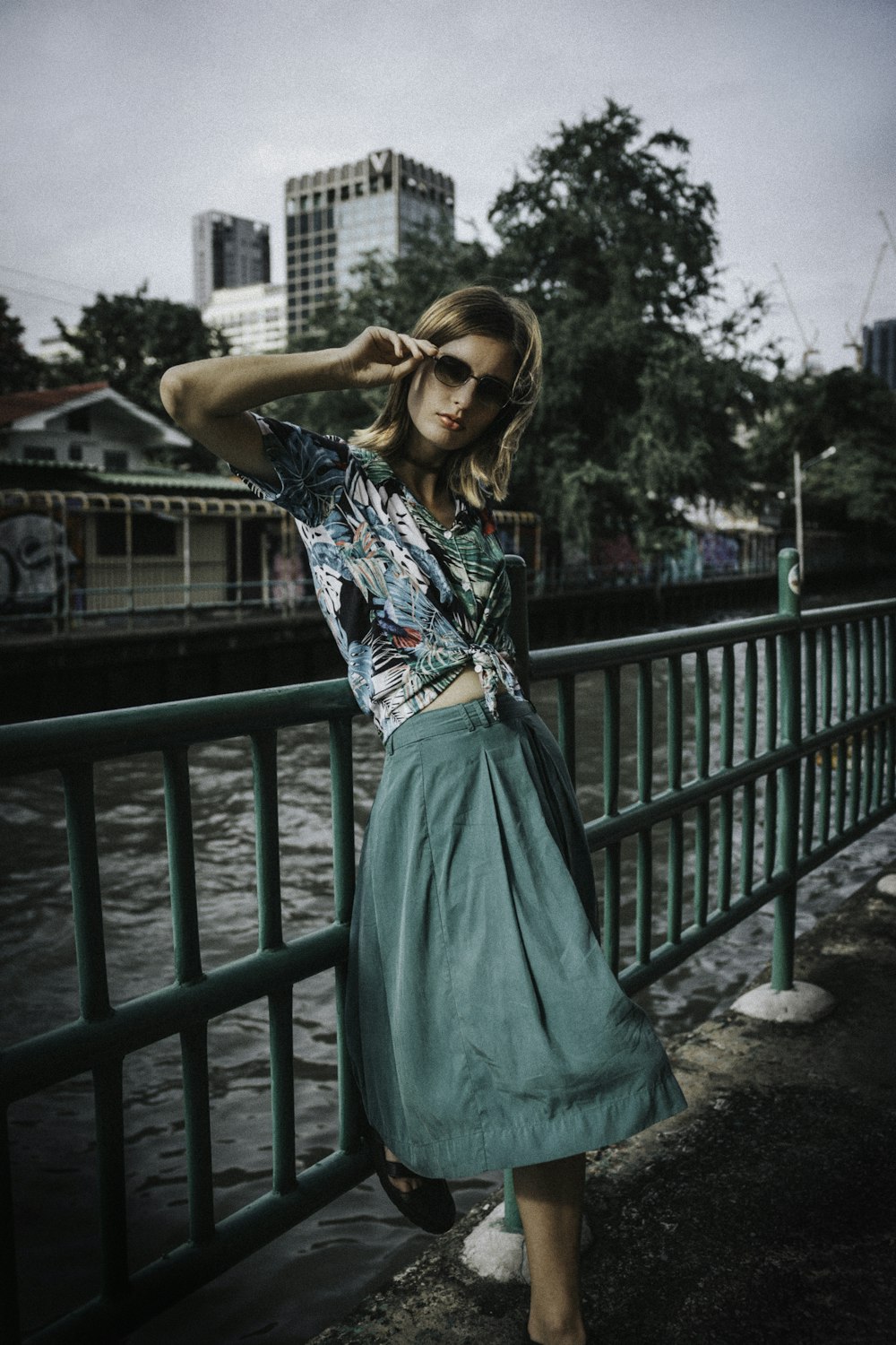 women's teal and white cap-sleeved tie-down blouse and skirt