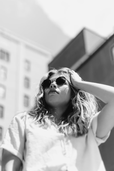 A group of friends and I decided to head down to Chattanooga to roam the city and take some photos. We came up on this open parking lot and I loved the way the buildings contrasted with her and the sky. I used my broken 50mm which helped narrow the focus down even more.