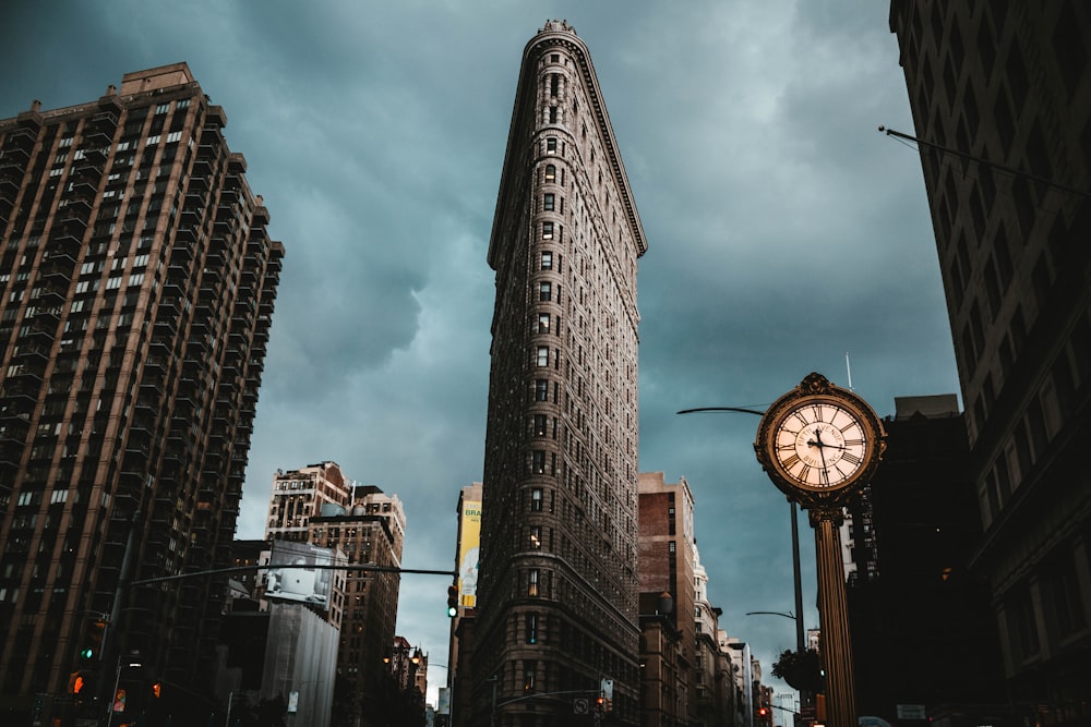low-angle photography of buildings under cloudy sky