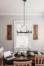 gray and black laptop computer on brown wooden table