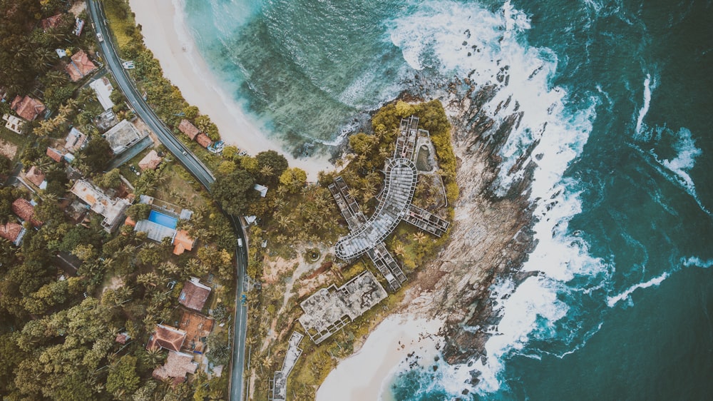 aerial photography of houses and buildings near body of water