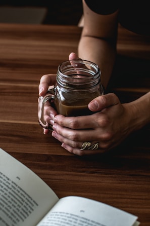 Close-up of hands holding a cup of tea during a calm moment.