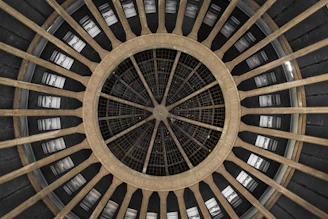 A sturdy, quickly assembled architectural hub shell standing resilient in rough terrain.