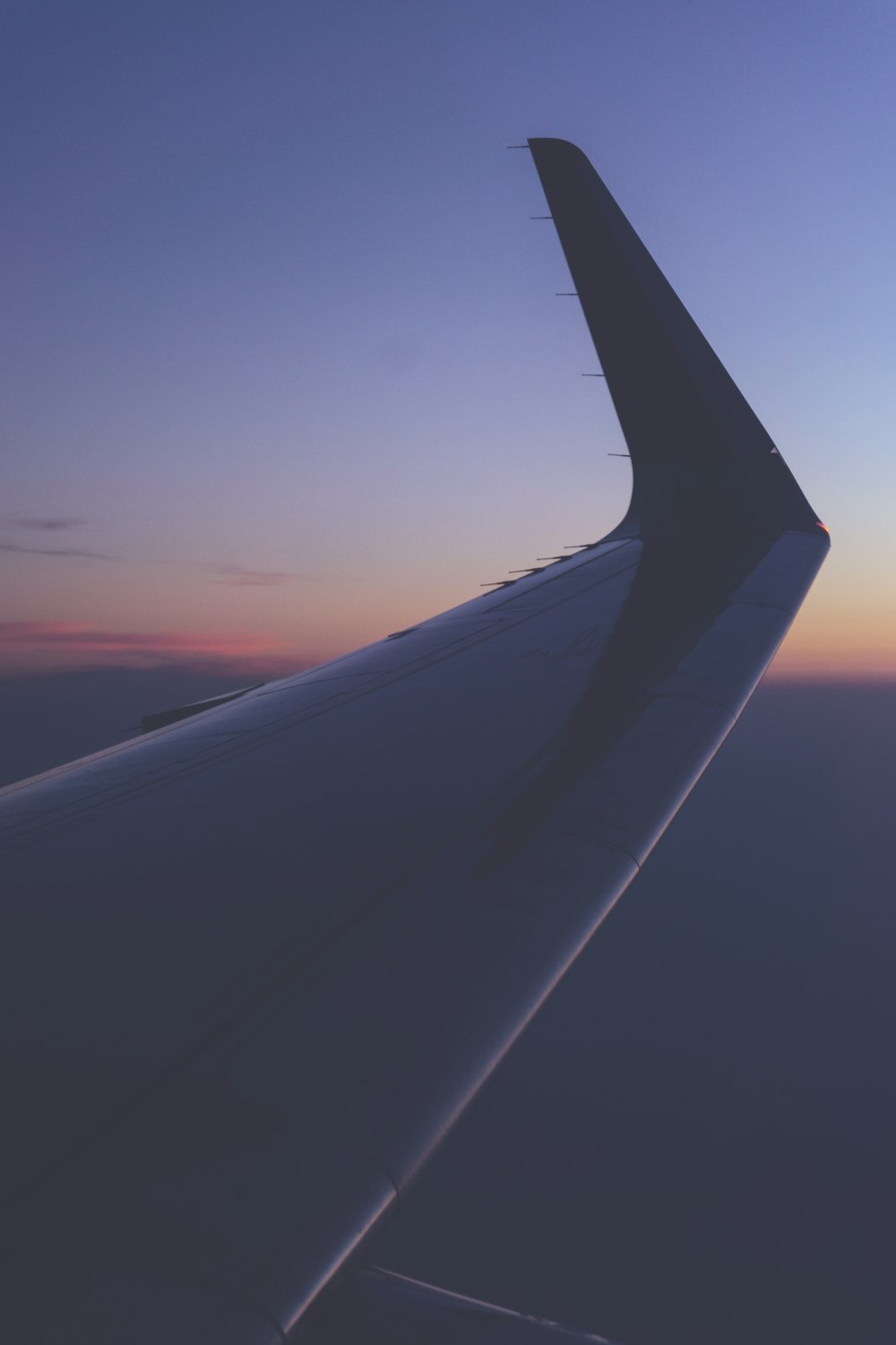 closeup photography on airplane wing at golden hour