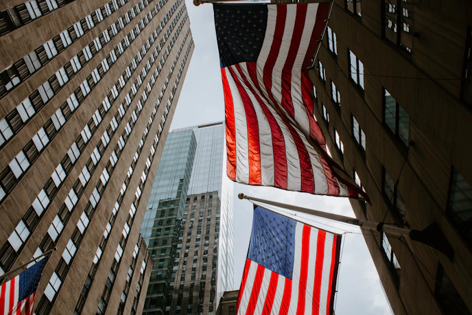 worm's eye view photography of USA flag on pole