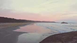 A serene Sri Lankan coastline at sunset, evoking calm and exclusivity.